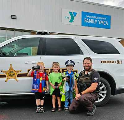 ictured are a few of our Day Campers from our Summer program L to R: Maxximus Routson, Iver Whitlow, Tyrion Termini, and Sergeant Matt Hein from the Washington County Sheriff's Department.  